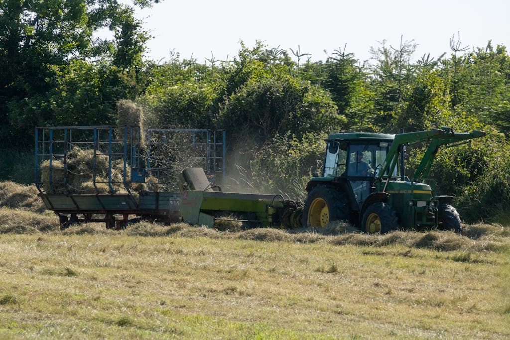 Old John Deere Tractor baling hay