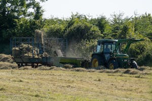 Old John Deere Tractor baling hay