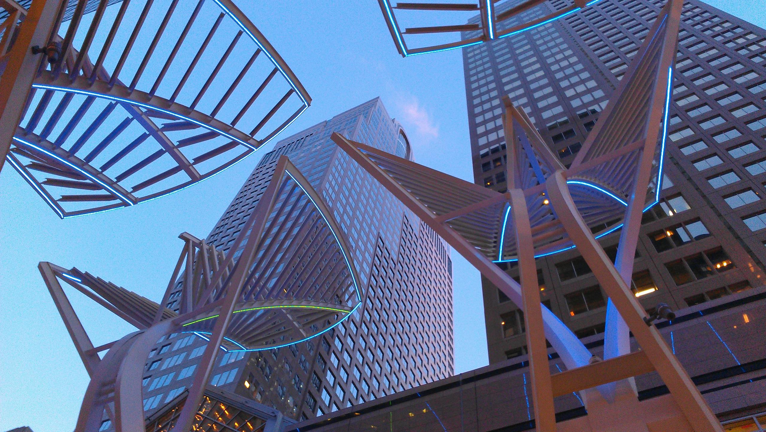 Futuristic architectural design featuring skyscrapers in downtown Calgary with geometric patterns.